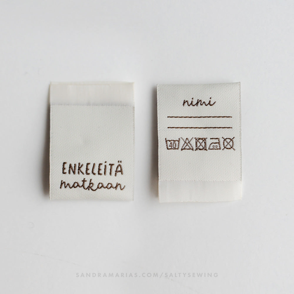 Vävt märke - Enkeleitä matkaan